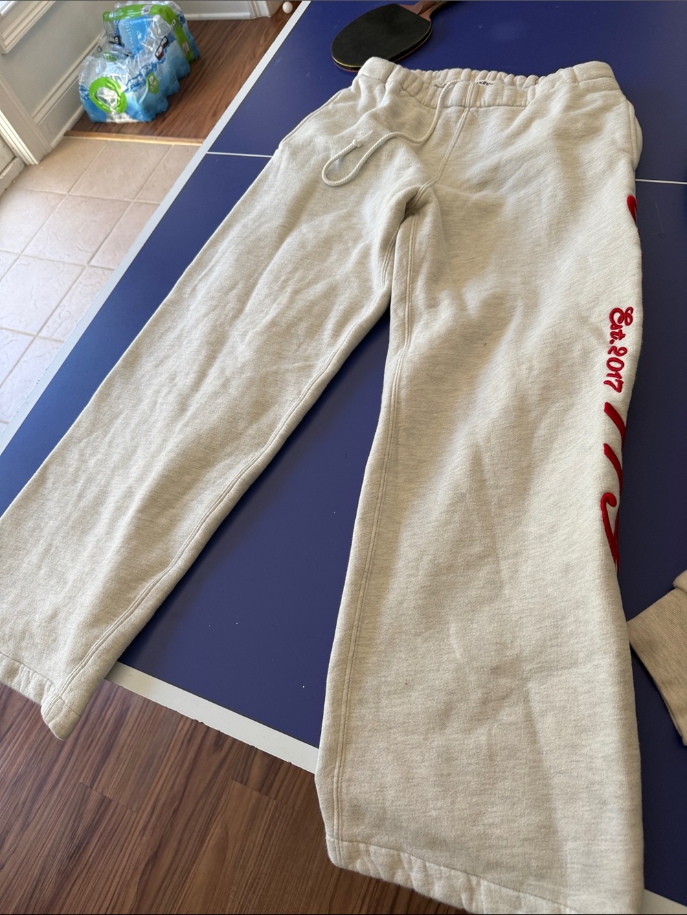 Madhappy Cream Track Pants with Red Script Detail